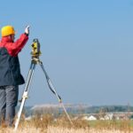 Land Surveyor In Field