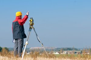 Land Surveyor In Field