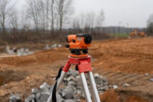 A level set up at a land surveying site